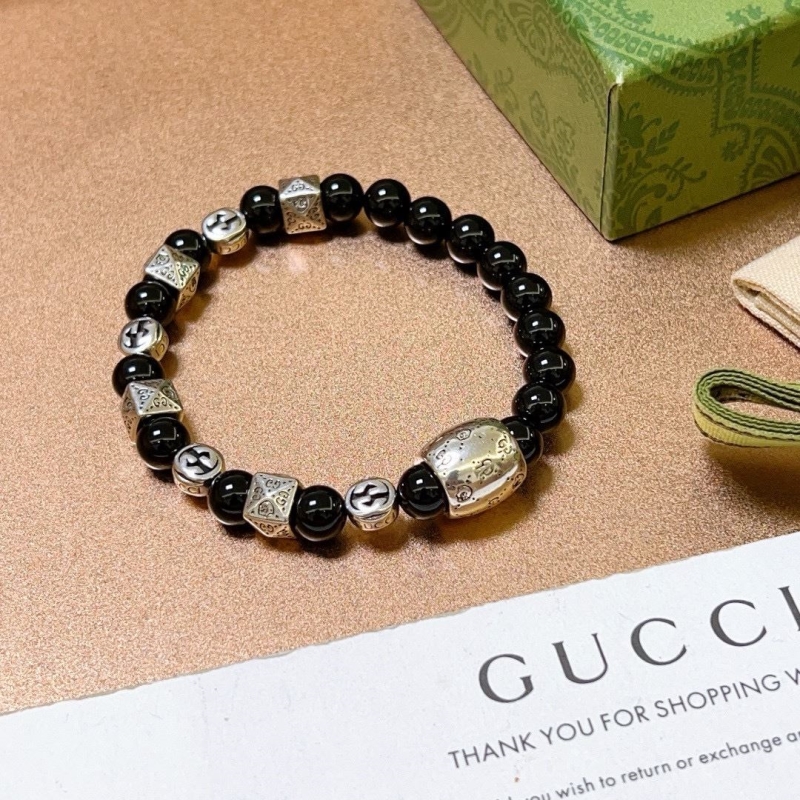 G*u*i bracelets